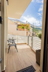 a view from the balcony of a house with a table at Marizaf house in Émbonas