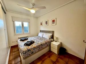 a bedroom with a bed and a window at Villa Alegre - 2 bed villa with private heated pool on Mar Menor Golf - family friendly in Torre-Pacheco +22 photos