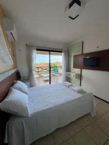 Ένα ή περισσότερα κρεβάτια σε δωμάτιο στο AQUAVILLE Porto das Dunas