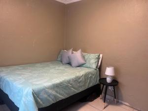 Ένα ή περισσότερα κρεβάτια σε δωμάτιο στο Lamont-Villa