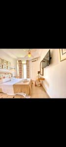 Ένα ή περισσότερα κρεβάτια σε δωμάτιο στο Hotel Plaza la marsa