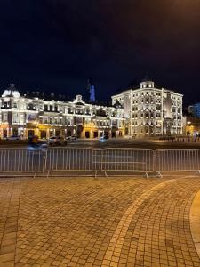 a group of buildings in a city at night at Caspian Hostel in Baku +47 photos