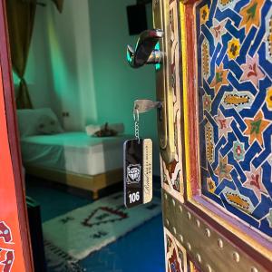 a door with a tag attached to it with a bedroom at Riad Dar El bellar in Fès
