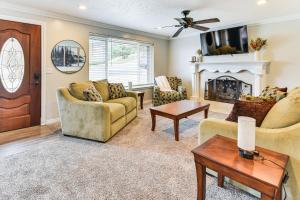 a living room with two couches and a fireplace at Mountain-View Retreat with Hot Tub in Centerville! in Centerville