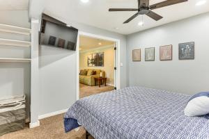 a bedroom with a bed and a ceiling fan at Mountain-View Retreat with Hot Tub in Centerville! in Centerville