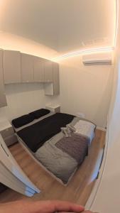 Ένα ή περισσότερα κρεβάτια σε δωμάτιο στο Cap tiny house