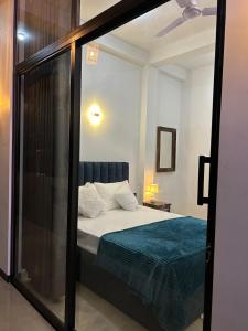 Postel nebo postele na pokoji v ubytování Tropictide rooms & resturants