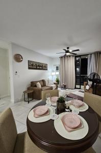 a living room with a table and a couch at CostaBella in Gqeberha