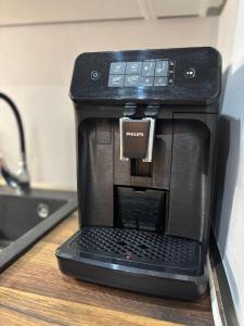 Příslušenství pro přípravu čaje a kávy v ubytování Apartmánový byt VYHNE