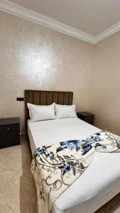 Ένα ή περισσότερα κρεβάτια σε δωμάτιο στο Immeuble ANAKHIL appartement surf