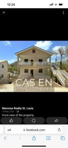 a screenshot of a house with a picture of a house at Carolus Suites in Gros Islet