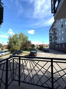 a balcony with cars parked in a parking lot at Stan na dan Bogdan Ub in Ub