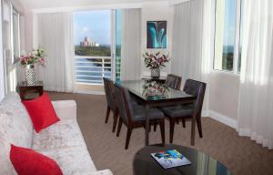 a living room with a table and chairs and a couch at GALLERY One - A DoubleTree Suites by Hilton Hotel in Fort Lauderdale