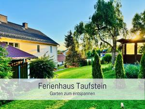 a house with a yard with a grass yard at Nur 15 Minuten bis Fulda - ideal zum Arbeiten - Am Vulkanradweg - 3 Schlafzimmer Große Terrasse - Grill - Ferienhaus Taufstein 1 in Herbstein +47 photos