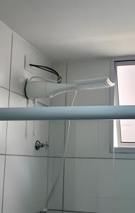 a glass shelf in a bathroom with a sink at Mel Prime Loft – executive apartment in Extrema, MG in Extrema +51 photos