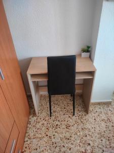 a desk with a black chair in a room at Casa EL CASTILLO ,a 5 kilómetros de la playa in Mazarrón +29 photos