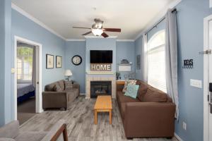 a living room with a couch and a fireplace at Sandbar Escape in Oceano