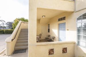 a staircase leading to a house with a door at Sandbar Escape in Oceano