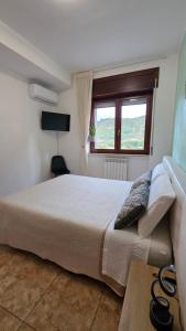 Ένα ή περισσότερα κρεβάτια σε δωμάτιο στο Di Gioia Home