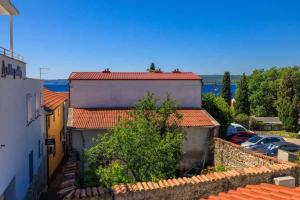 an overhead view of roofs of buildings with cars at Holiday home in Selce 54425 in Selce