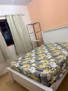 Ένα ή περισσότερα κρεβάτια σε δωμάτιο στο Casa simples e aconchegante em Unamar - Cabo Frio