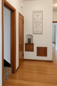 an empty room with a door and a picture on the wall at The Hillside - Historic Tudor retreat in SLC in Garden Towers Condominium