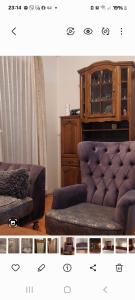 a living room with a couch and a wooden cabinet at Lux apartman in Banja Luka