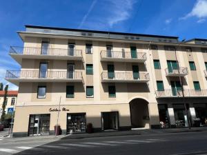 a large building with balconies on the side of a street at Ivrea Centro - Attico Top in Ivrea