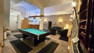 a living room with a pool table in it at Burgblick in Nossen