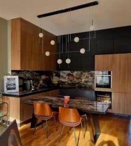 Η κουζίνα ή μικρή κουζίνα στο Le Galeriste - parking inclus