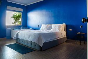 Postel nebo postele na pokoji v ubytování Habitare - La Fortuna