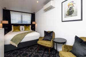 Postel nebo postele na pokoji v ubytování Regent of Rotorua Boutique Hotel + 67 fotografií