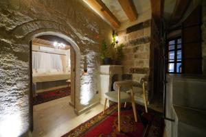 a room with a room with a bed and a chair at View Cave Hotel in Goreme +277 photos