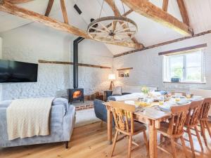 a living room with a dining table and a fireplace at 3 Bed in Beeston 88223 in Beeston