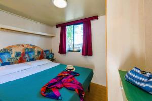 Ένα ή περισσότερα κρεβάτια σε δωμάτιο στο Mobilehomes in Tuoro Sul Trasimeno - Umbrien 24273 +19 φωτογραφίες