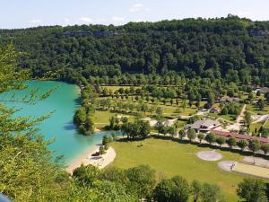 an aerial view of a park with a lake at Maison Lac de Chalain - Jura in Fontenu
