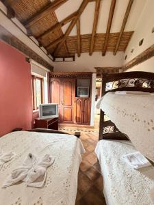 Ένα ή περισσότερα κρεβάτια σε δωμάτιο στο La Casa Colonial +52 φωτογραφίες