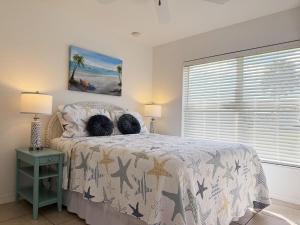 a bedroom with a bed with two pillows on it at Pet-Friendly 3BR – Relax & Explore Beaches & Golf in Rotonda