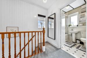 a bathroom with a sink and a toilet at Quincy's Homes in Dartford +37 photos