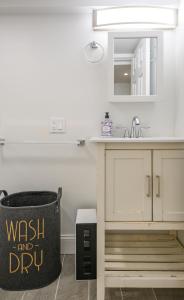 a kitchen with a sink and a trash can at 20 Mins to Times Sq. EWR | Cozy Apartment | Sleeps 4 in Jersey City