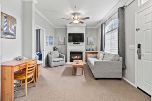 a living room with a couch and a table at Coastal Cutie in Oceano