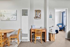 a dining room with a table and chairs at Coastal Cutie in Oceano