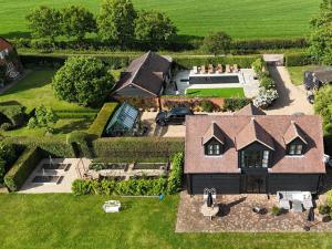 an aerial view of a house with a yard at 1 Bed in Horsham 86961 in Rudgwick