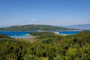 a view of a beach and a body of water at Apartments in Lopar - Insel Rab 26467 in Lopar