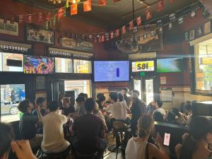 a group of people sitting in a restaurant at Glengarry Castle Hotel in Sydney