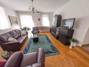 Μια τηλεόραση ή/και κέντρο ψυχαγωγίας στο Holiday home in Gyenesdias - Balaton 54827