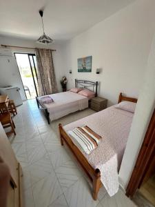 Ένα ή περισσότερα κρεβάτια σε δωμάτιο στο Alia Suites and Spa