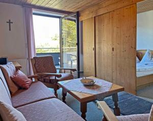 a living room with a couch and a coffee table at Apartment Strobl 1 in Strobl