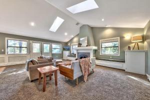 a living room filled with furniture and a fireplace at Minnow's Run in Brockway Vista