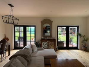 a living room with a couch and a table at Charming Victoria Character Home-Pet Friendly in Victoria